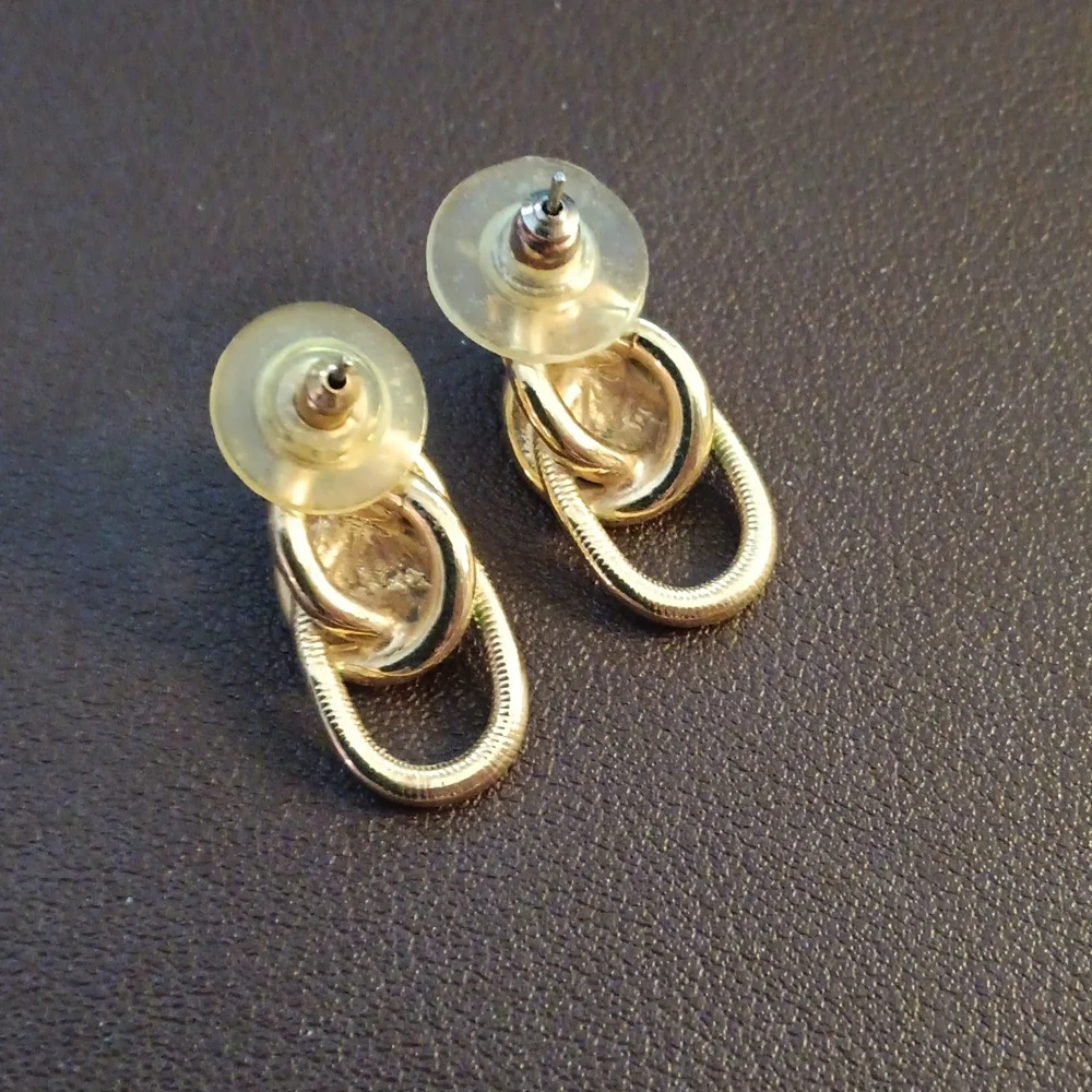 Elegant Gold and Silver Knot Earrings - Picture 2 of 4
